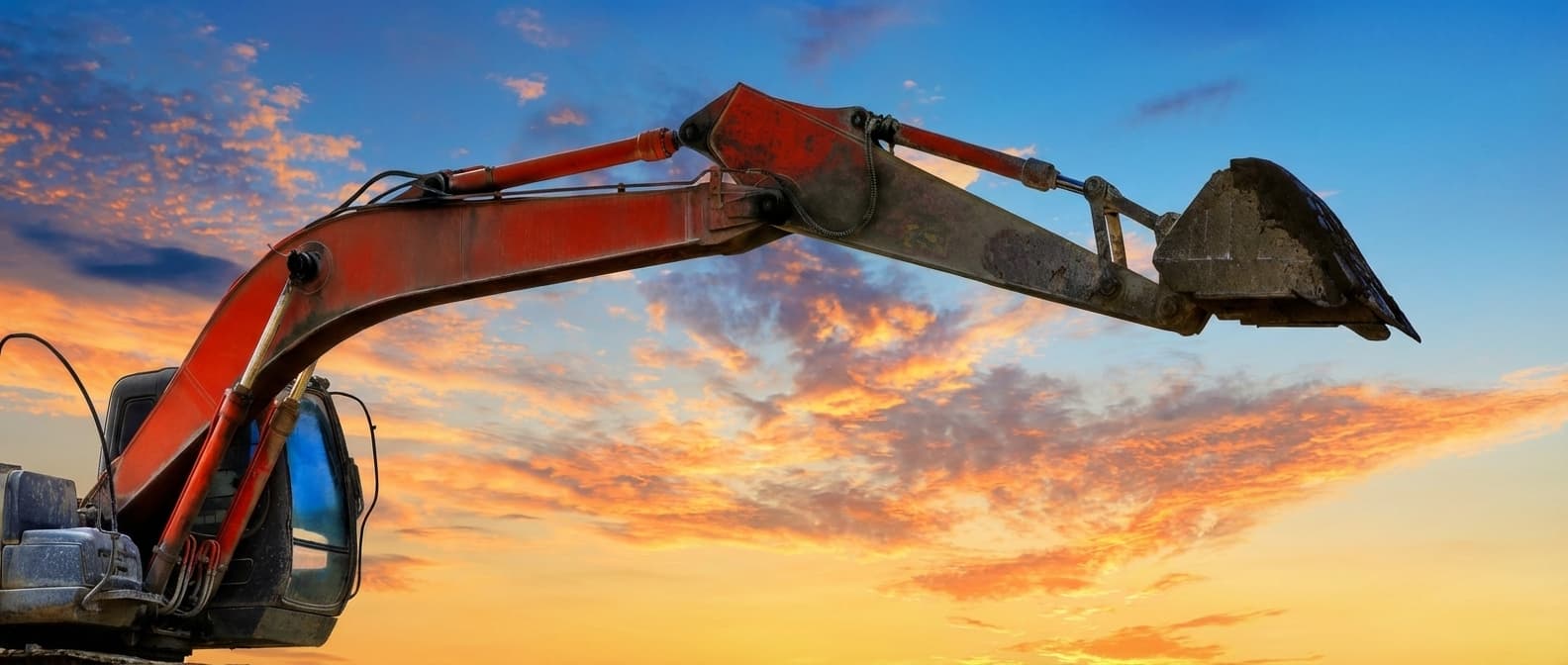Excavator at sunset