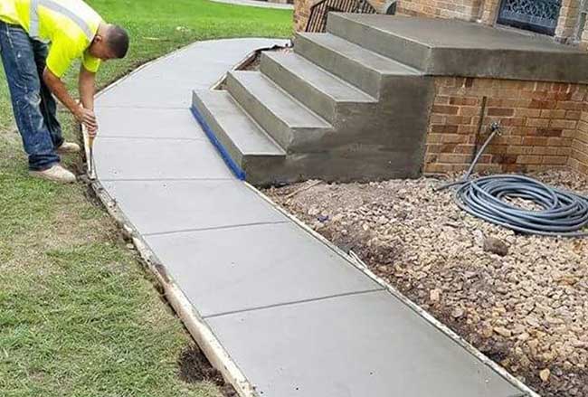 Concrete walkway installation in Bryan
